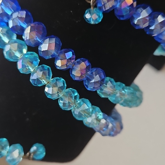 CRYSTAL AB LIGHT BLUE & MEDIUM BLUE Beads on Wire Bracelet. 2 1/2" Dia. - Picture 3 of 6